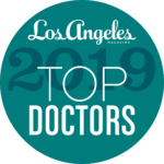 A badge that says los angeles magazine top doctors 2 0 1 9