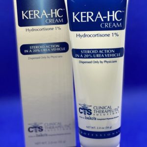 A blue box and tube of cream on a table.